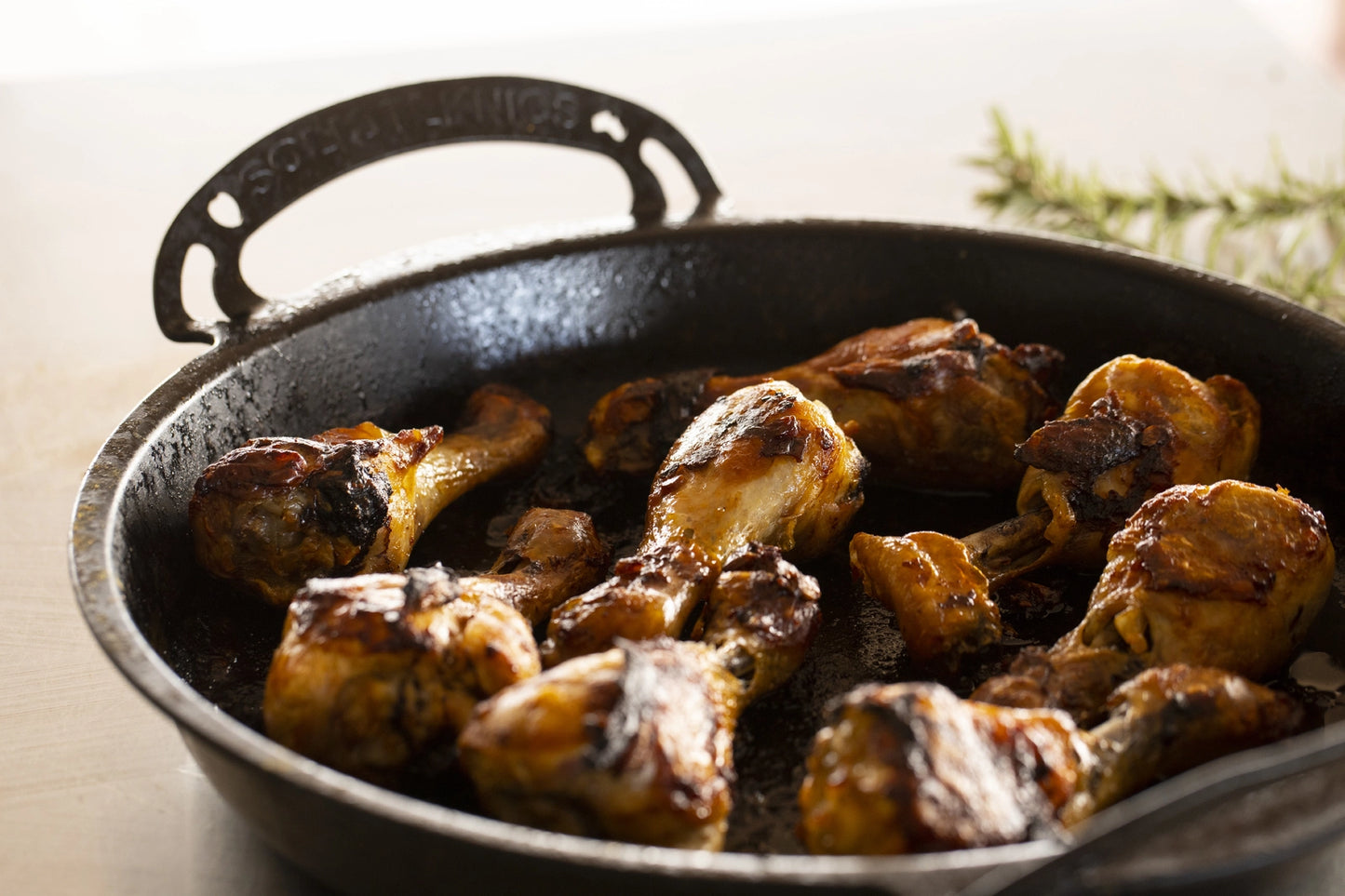 35cm Seasoned Iron BIGGA Skillet quenched for non-slip surface, durable nonstick pans, made in australia, great for camping over the fire cooking outdoors or at home. chicken drum sticks by solid teknics