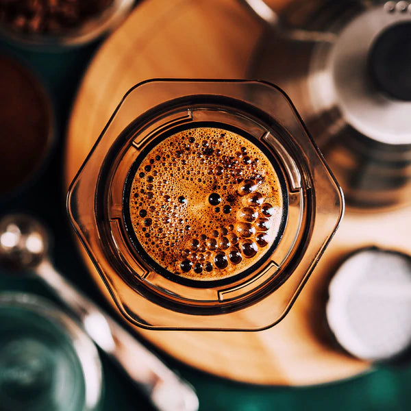 Aeropress coffee maker, aerial. A camp coffee equipment main stay, for coffee on the go. Use fresh ground coffee for best results. Enjoy coffee at camp, next to the fire.