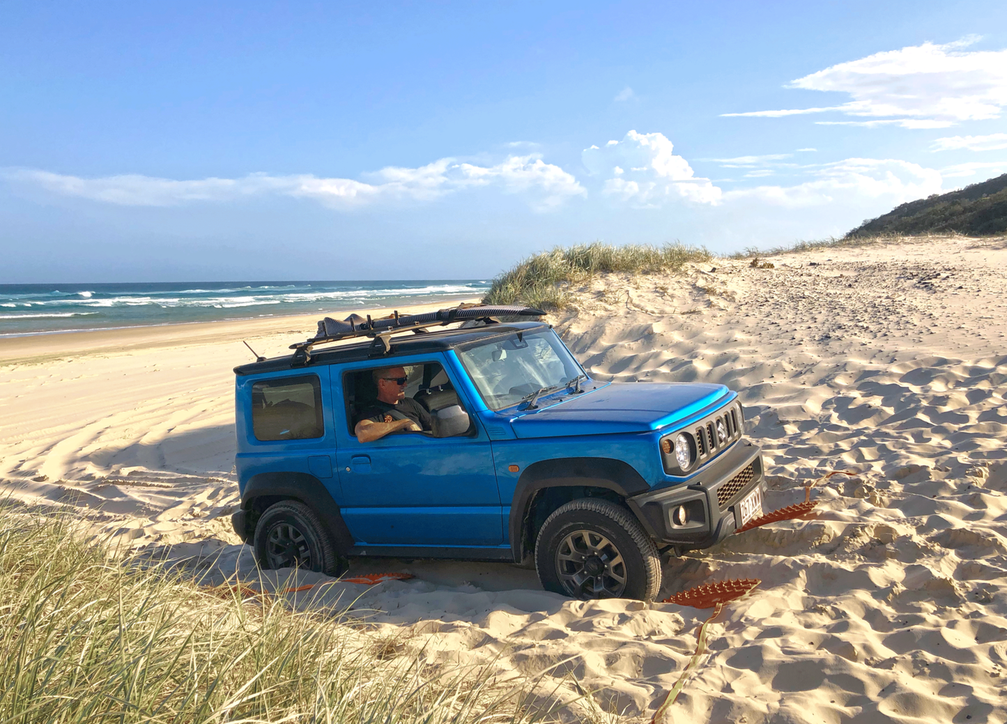 maxtrax mini jaxbase black showing the base. overlanders traction aid in a compact package. suzuki jimny in the sand